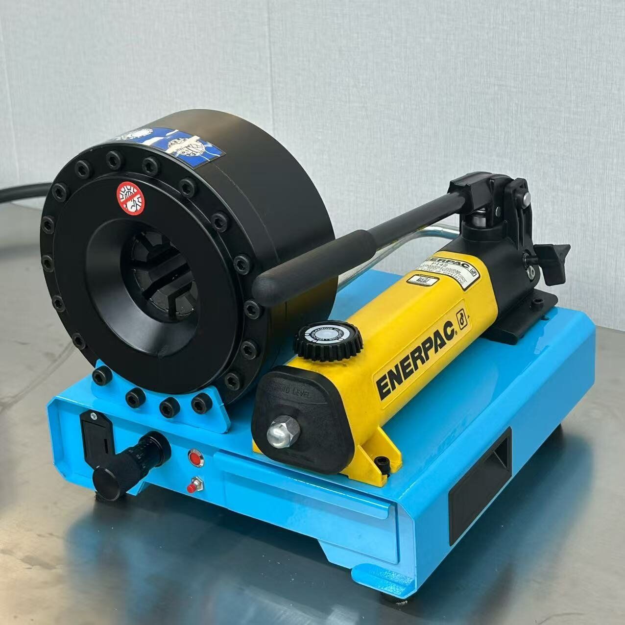 P16HP portable manual hydraulic hose crimper featuring an Enerpac pump, forged steel head, and built-in dies drawer for field service.